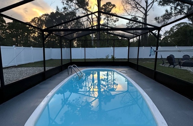Paradise awaits! Renovated 4-bed oasis with pool, fenced yard. Lake Placid, FL.