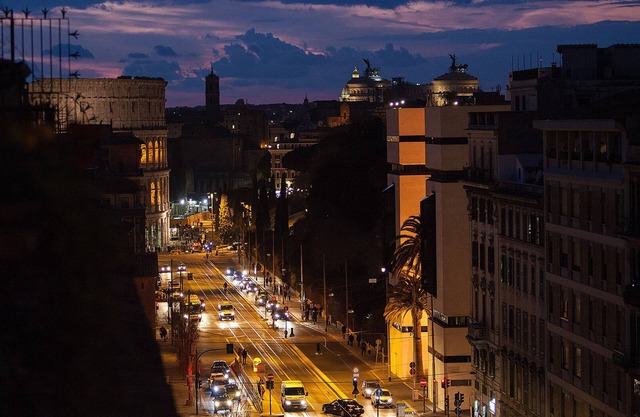 Penthouse with large terrace overlooking Colosseum and center of Rome.