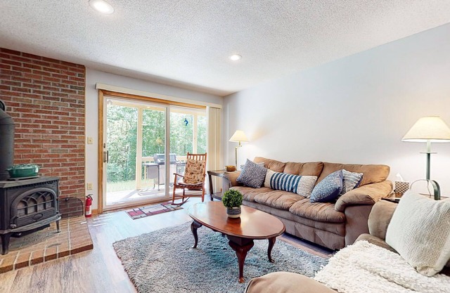 Pleasant dog-friendly condo with wood stove, gas grill, pool, & kitchen