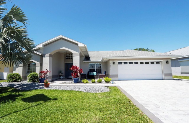Poolside Paradise is a luxurious modern home in the popular community of Parker Lakes