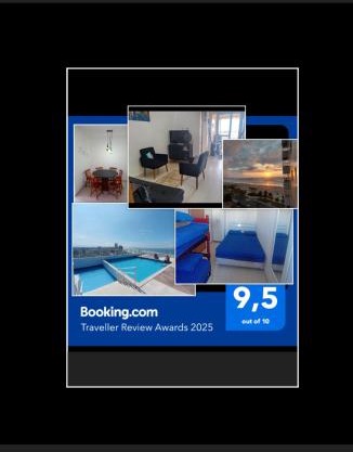 Prédio com piscina na cobertura frente ao mar, apartamento para até 6 pessoas e 3 crianças até 8 anos, churrasqueira na sacada, Wi-Fi grátis, NÃO oferecemos roupas de cama e banho, 1 vaga de garagem, na Praia Grande-Vila Mirim