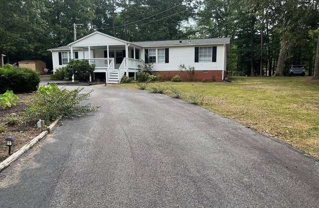 Relax at this Golf Community House with nearby water access!