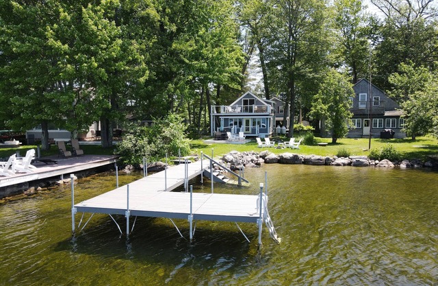 Relax in Raymond's lakefront 2-bedroom vacation home, just steps to Sebago Lake