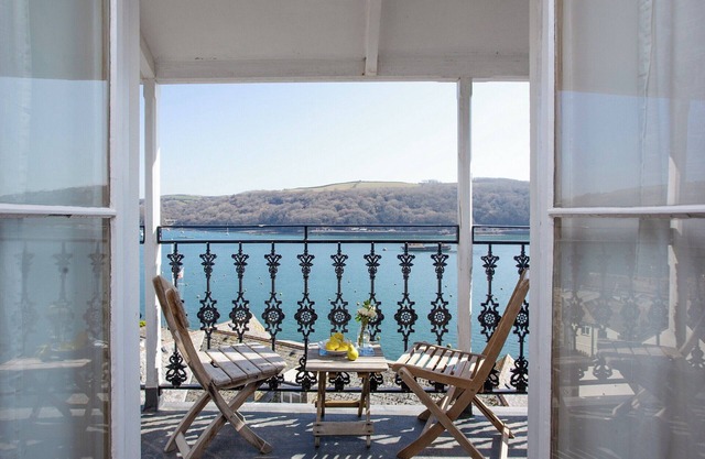 Relax on the balcony and watch the boats sail by.