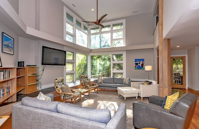 Resting in treetop, two golf carts close to island amenities