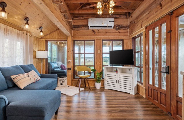 Rustic cabin oasis on 2.5 acres with a fishing pond