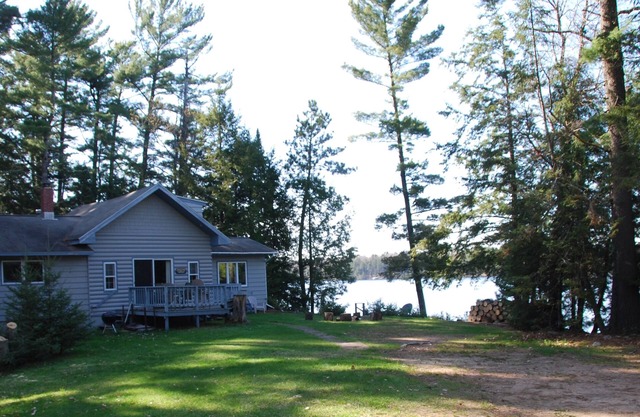 Secluded 2 acre Lakefront Home with boat and motor included on 5 lake chain.