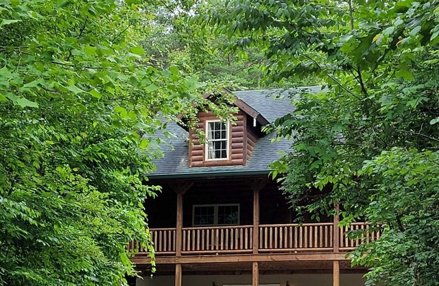 Secluded cozy cabin nestled among the hemlocks and rock formations in Hocking