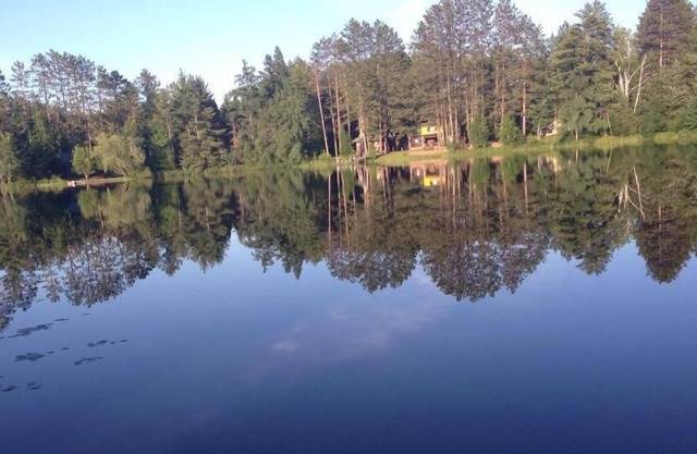 Secluded lake cabin on 2 acres with swimming beach, dock & sauna, new roof