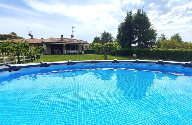 Semi-detached Villa with private pool and large garden.