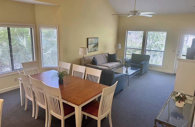 Shaded 2BR Nature Escape with Bikes, Porch Lounging and Peaceful Water Backdrop