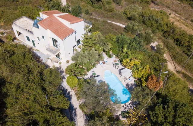 Shiny villa Adriana into green nature overlooking Georgioupolis bay.