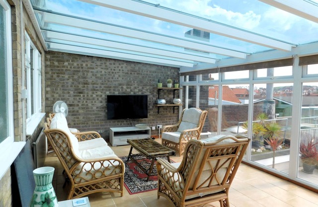 Sky View - Enjoy panoramic roof top views from the sunny conservatory or outside deck.