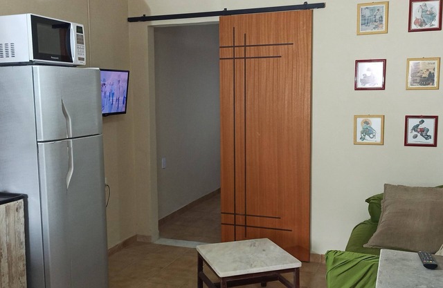 Small and cozy, close to the beach and everything! There's even a pet area <3