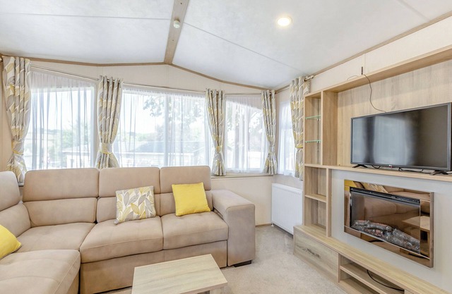 Spacious and luxurious 12ft-wide caravan with one double and one twin bedroom.
