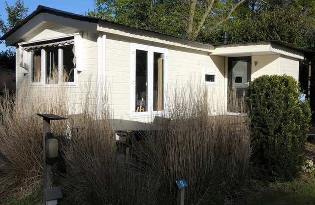Spacious chalet for rent with nice view over the grounds against forest