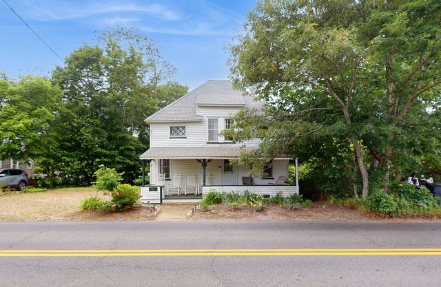 Spacious colonial home close to town with AC, porches, & W/D