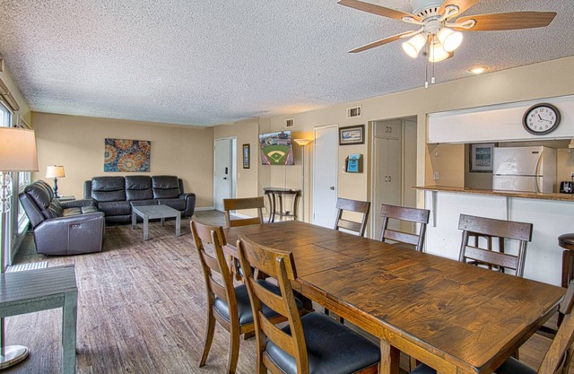 Spacious upper unit located just one house from the sand!