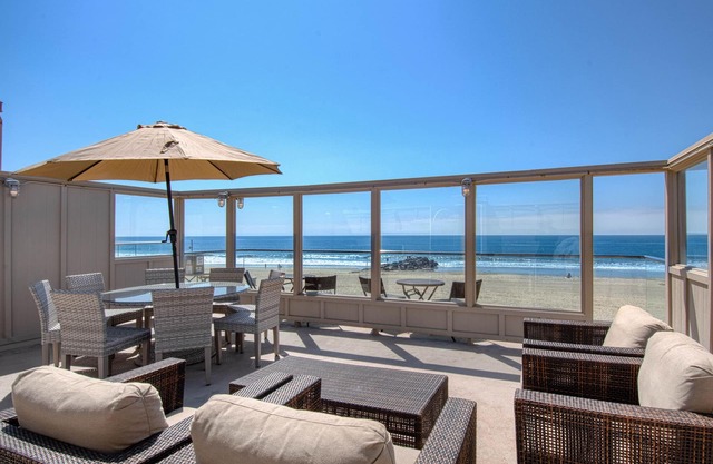 Spectacular oceanfront upper unit with amazing views from awesome roof top deck!