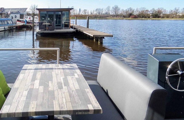 Spend a dream vacation on the water in this modern houseboat.