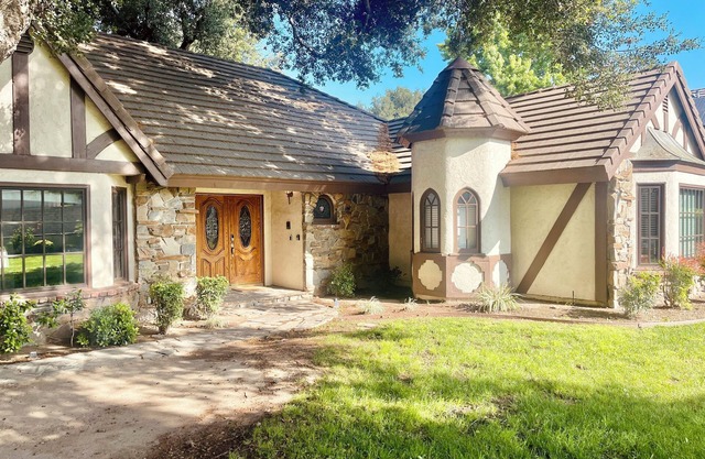 Sprawling 4-Bedroom Tudor Retreat with Spacious Backyard Oasis