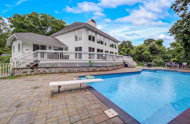 Sprawling sun-lit home with private heated pool, arcade, air hockey, & grill