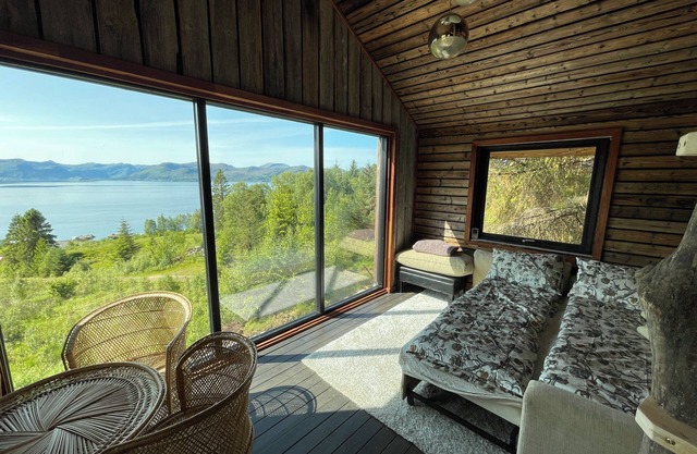 Stunning fiord panorama view off-grid forest cabin