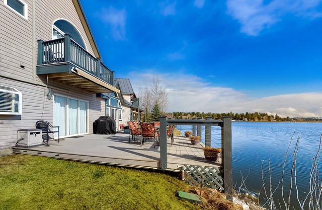 Stunning lake house with dock, firepit, grill, canoes, & mountain views