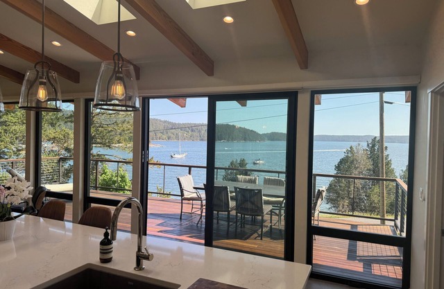 Summer Daze - enjoy in/outdoor living in this new ocean front designer home.