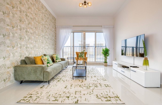 Sunny 1BR at Canal Residences West Dubai Sports City by Deluxe Holiday Homes