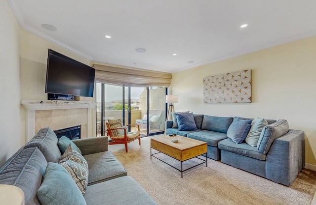 Sunny & serene, two-story, oceanfront condo w/a shared, heated pool & free WiFi