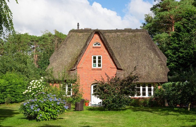 Thached roof house in Nebel on the island Amrum - located in the beautiful woods