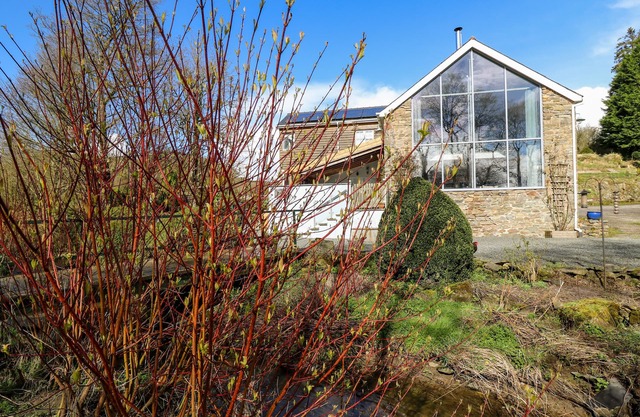 THE BARN AT GLANOER, pet friendly, with open fire in Hundred House