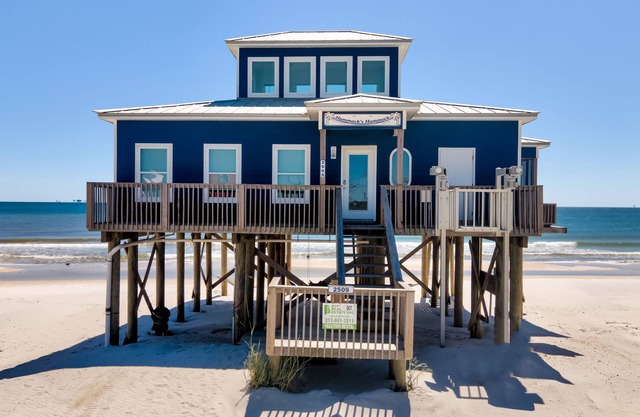 The beach is your backyard in this gulf-front cottage!