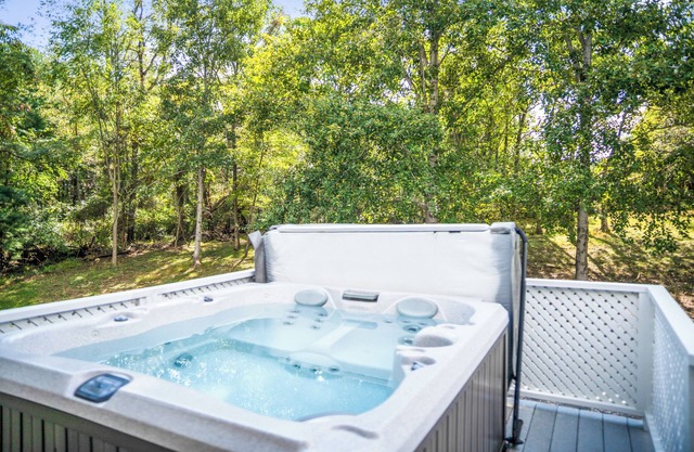 The Blue Ridge Cottage is a second floor room steps from the Main Inn. It has its own private deck and entrance which offer wooded and valley views. This cottage has a private 4 person Sundance Spa tub, and an outdoor propane fire pit. It features a