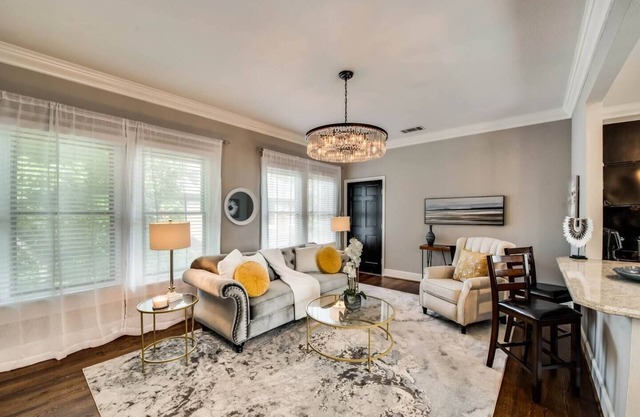 The main living area includes a spacious living room, dining area, and spa-inspired bathroom. Guests enjoy complimentary high-speed WiFi, washer/dryer, and all essential amenities for comfort and convenience.