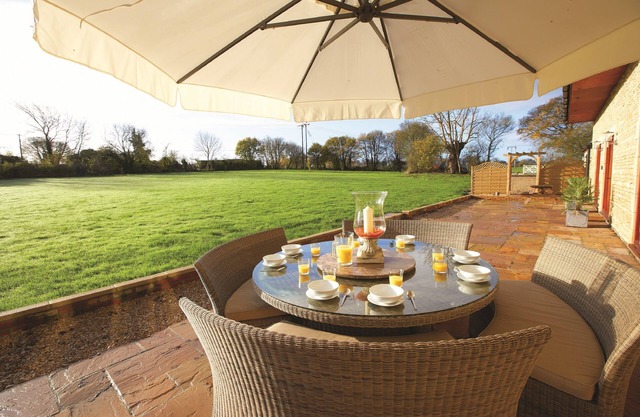The Old Stables is a pretty farm cottage in Wiltshire, sleeps eight people, child friendly.