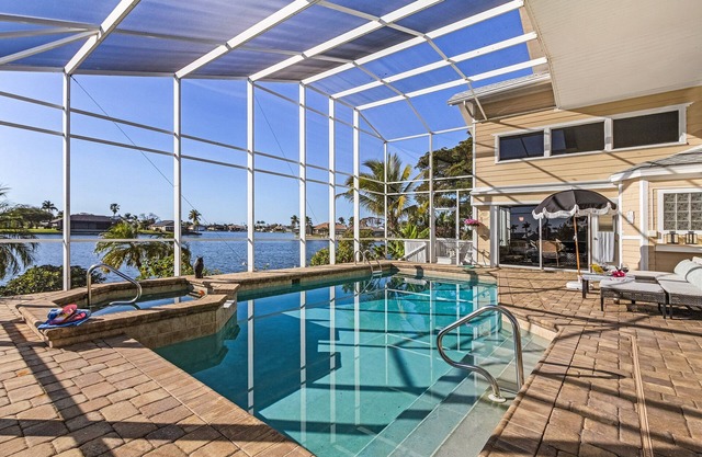 THE PENINSULA - fresh waterfront paradise, pool & spa, spacious home
