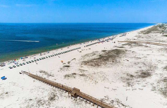 Third floor ocean view condo with shared pool, hot tub, and beach access