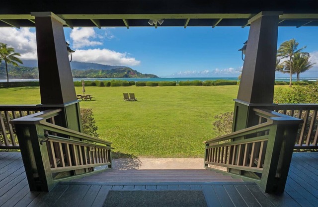 This beautiful beachfront Hanalei Bay home is located steps from the sand