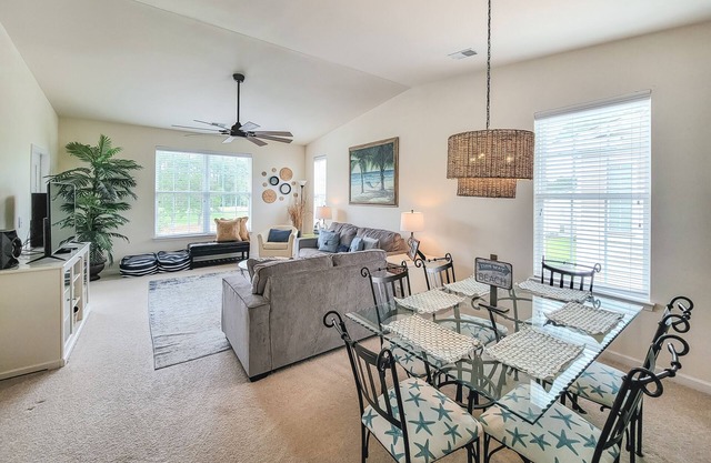 Top-floor, end-unit condo with water/golf course views, pools, tennis, & grills