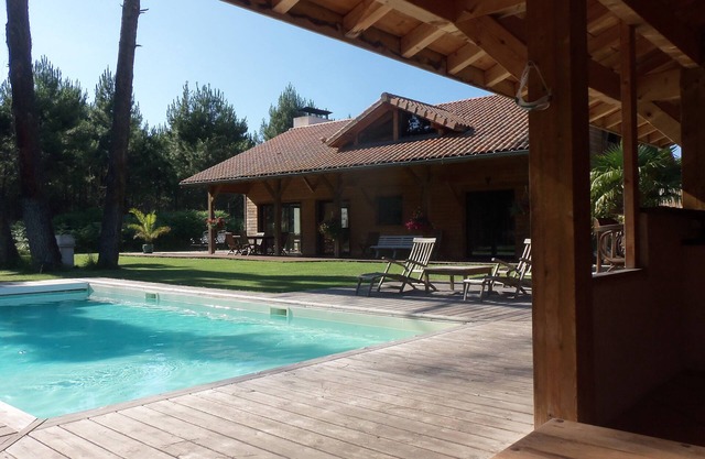 Traditional wooden house with heated swimming pool and pool house in Moliets - France