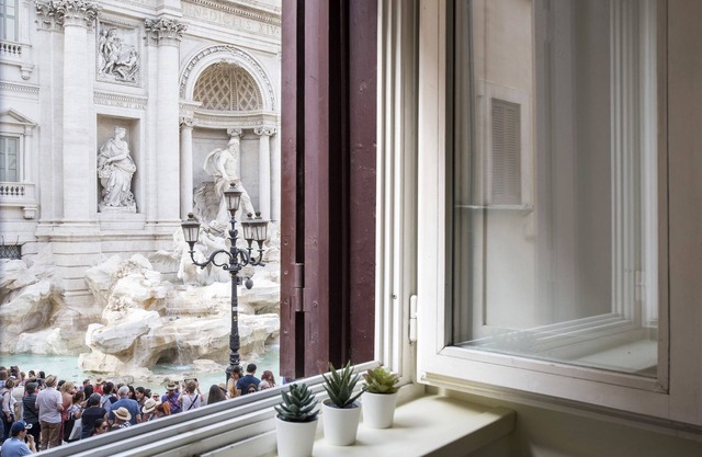 Trevi fountain from your window- center Rome