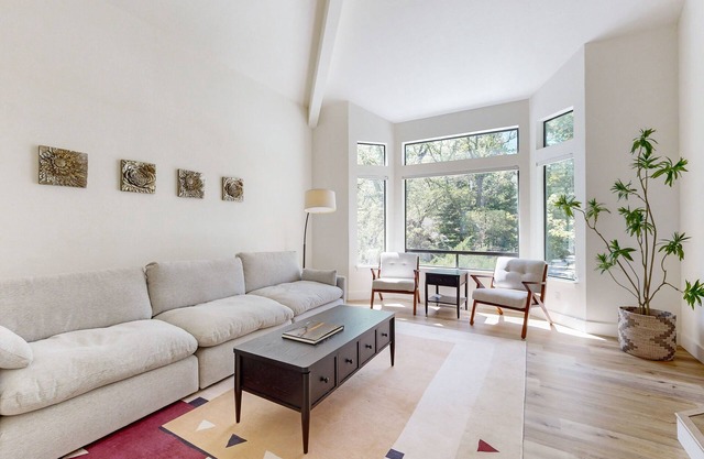 Two-story golf course-adjacent getaway with a patio, washer/dryer, central AC