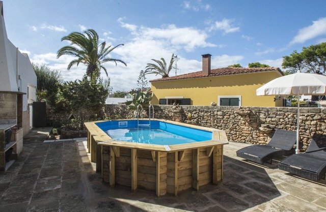 Typical Menorcan house steps from the beach. Pool, garden, barbecue and fireplace