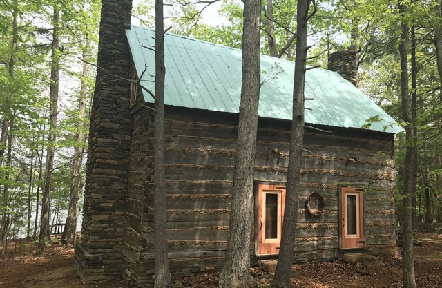 Unique Historical log cabin with private beach and 300 ft. of waterfrontage.