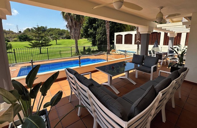 Unwind at this front-line private luxury villa with panoramic golf and sea views