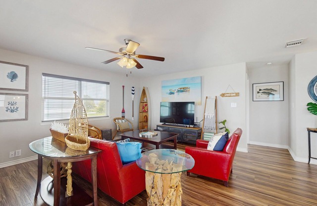 Vibrant bay front home with fenced yard & large decks - steps to sand & fishing
