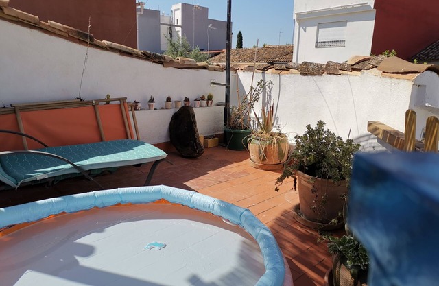 Village house with large terrace.
