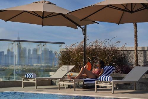 Vogue One Bedroom Apartment at Novotel Jumeirah Village Triangle, 16th Floor Skyline View and Balcony, Pool and Gym Access Included